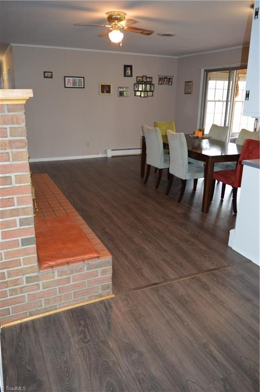 402 Springwood Road Asheboro, NC 27205 - Photo 7 of 21 Dining room goes out to the sunroom. Could also be used as a den if wanted.