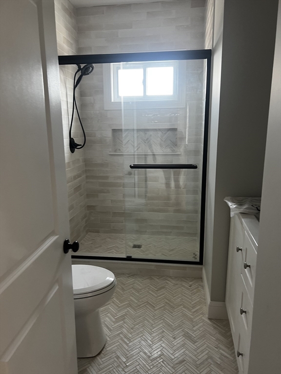 2039 Pleasant Street, Unit 2 Fall River, MA 02723 - Photo 4 of 10 a bathroom with a shower and a toilet