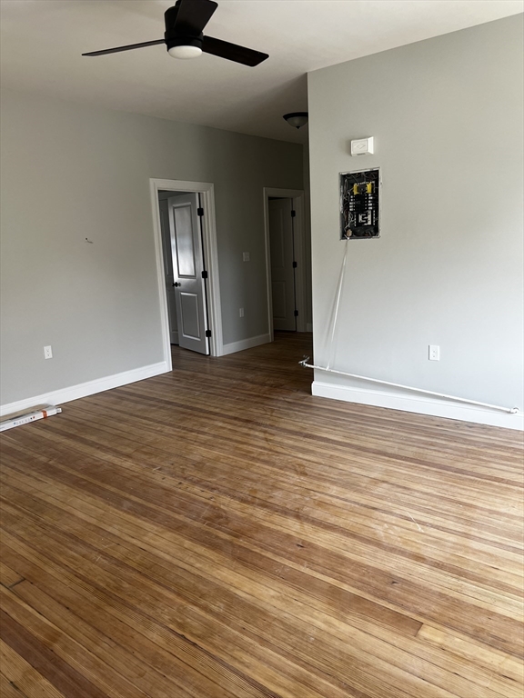 2039 Pleasant Street, Unit 2 Fall River, MA 02723 - Photo 8 of 10 wooden floor in an empty room