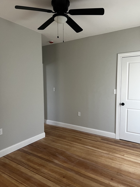 2039 Pleasant Street, Unit 2 Fall River, MA 02723 - Photo 10 of 10 a view of an empty room with wooden floor