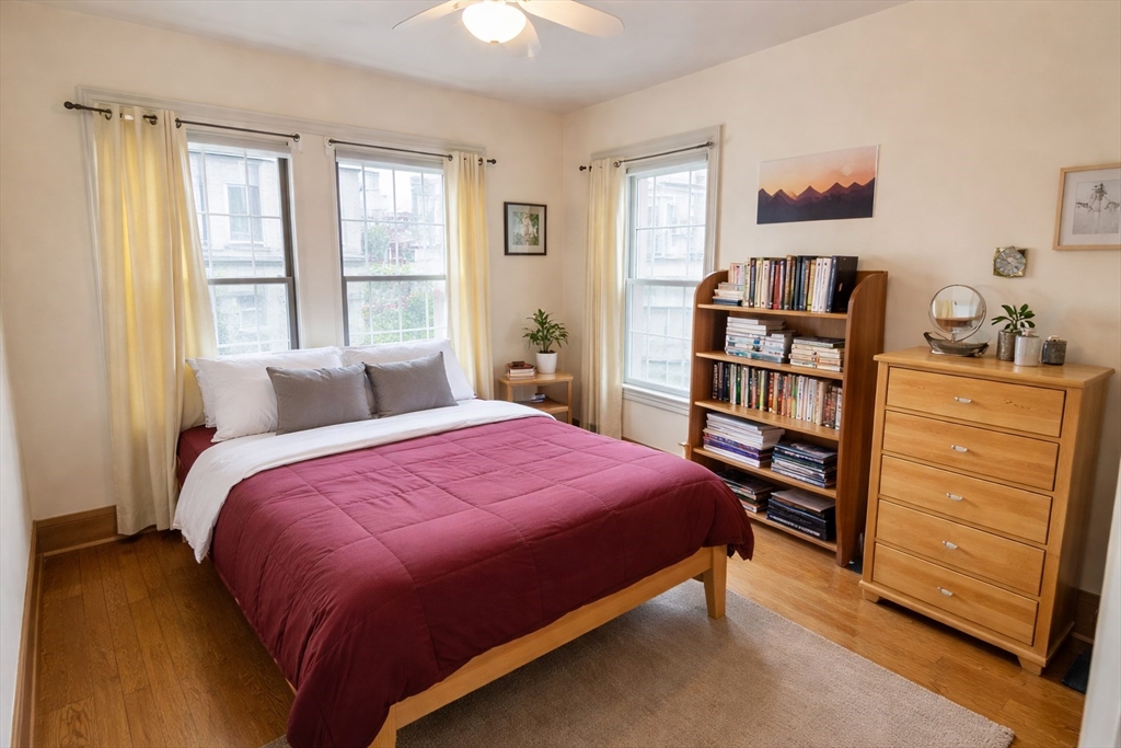 53 Hillside Street, Unit 2 Boston, MA 02120 - Photo 5 of 10 a bedroom with a bed and a book shelf