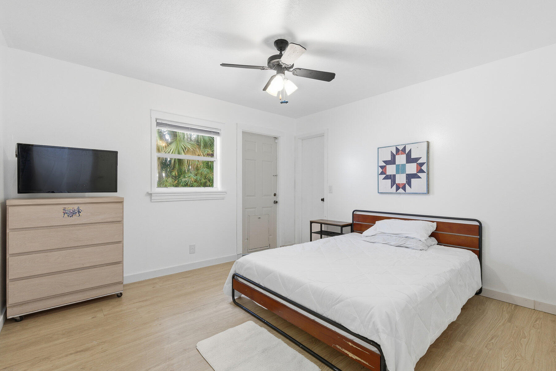 17251 38th Road North Loxahatchee, FL 33470 - Photo 17 of 35 a bedroom with a bed and a flat screen tv