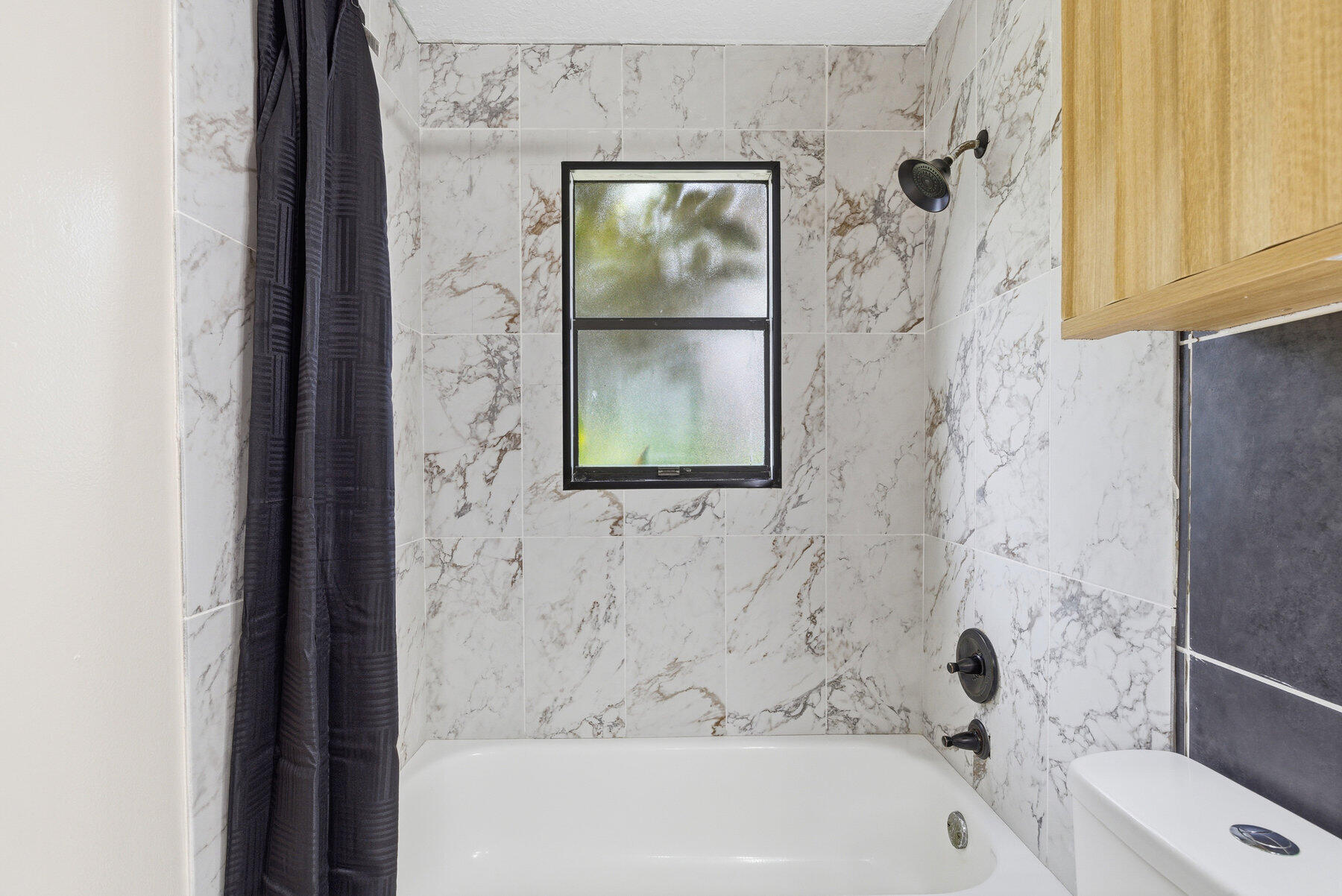 17251 38th Road North Loxahatchee, FL 33470 - Photo 23 of 35 a bathroom with a bathtub and a shower