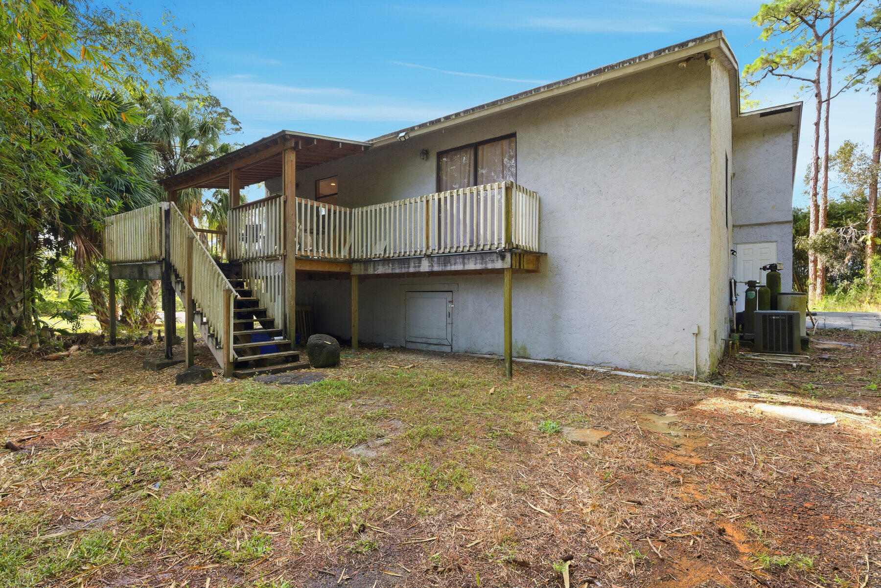 17251 38th Road North Loxahatchee, FL 33470 - Photo 28 of 35 a house with trees in the background