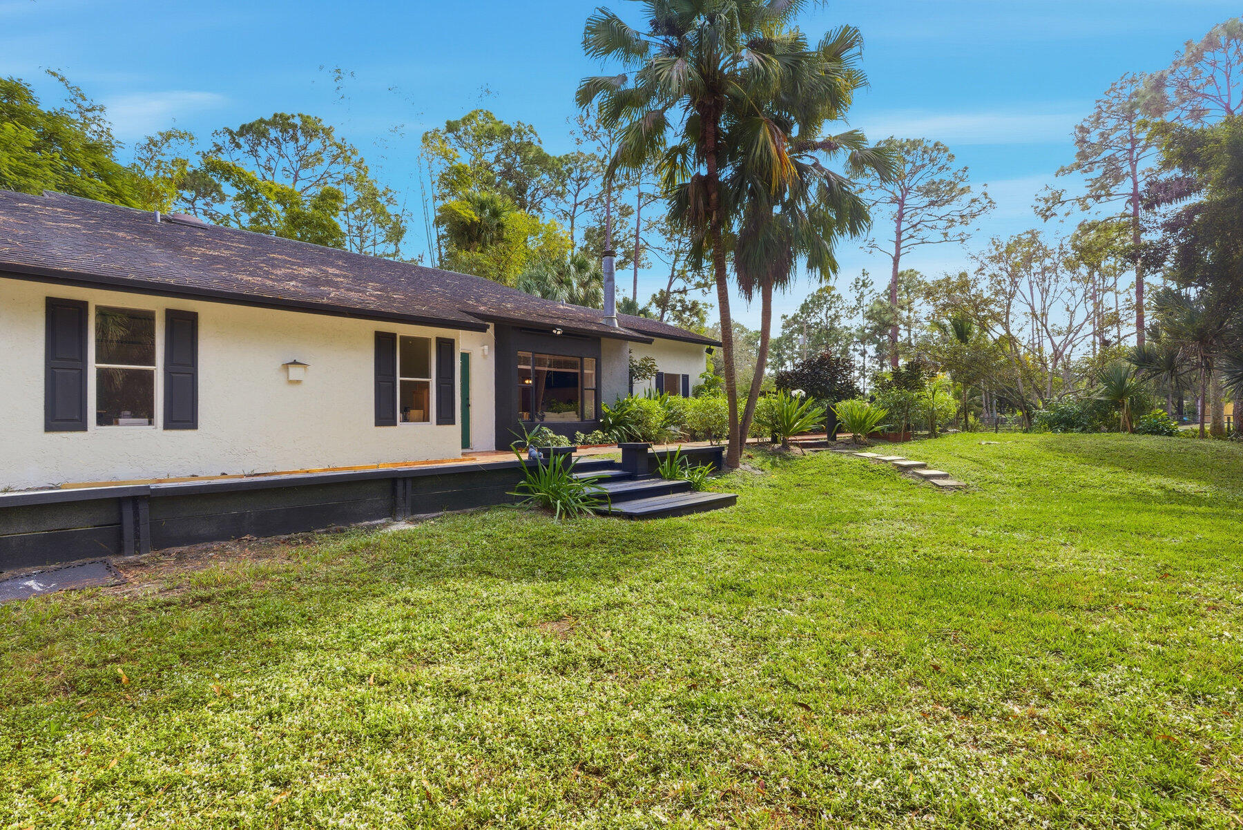 17251 38th Road North Loxahatchee, FL 33470 - Photo 35 of 35 a view of a house with backyard and sitting area