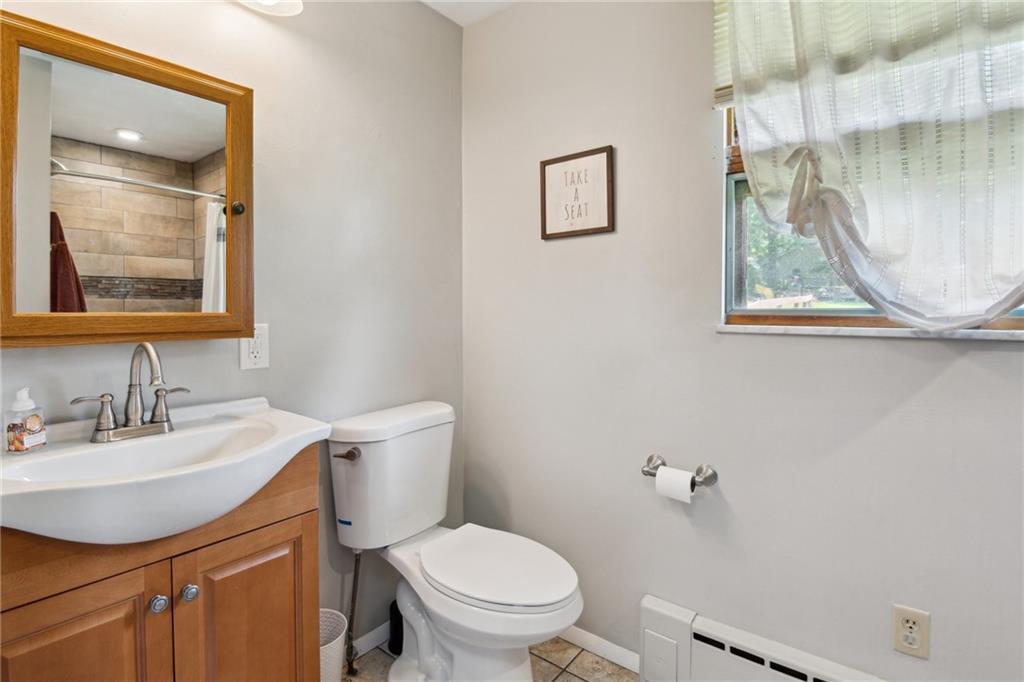 1343 Venetia Road Eighty Four, PA 15330 - Photo 19 of 27 a bathroom with a toilet a sink and a mirror