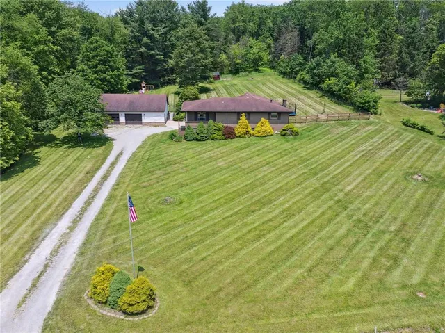 swimming pool view with a seating space