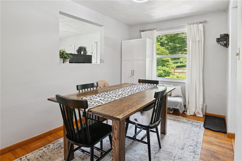 1343 Venetia Road Eighty Four, PA 15330 - Photo 7 of 27 a view of a dining room and livingroom with furniture window and wooden floor
