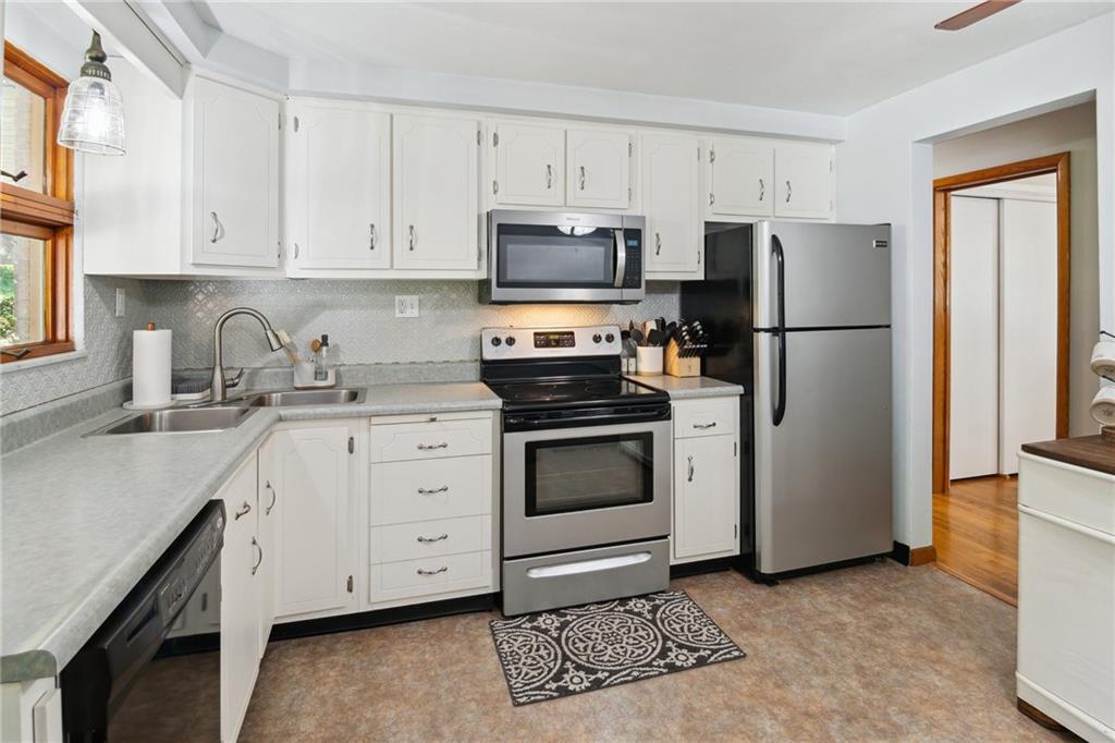1343 Venetia Road Eighty Four, PA 15330 - Photo 9 of 27 a kitchen with cabinets stainless steel appliances and a counter space