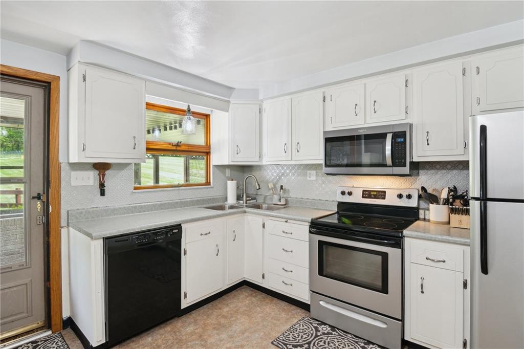 1343 Venetia Road Eighty Four, PA 15330 - Photo 10 of 27 a kitchen with cabinets stainless steel appliances and a window