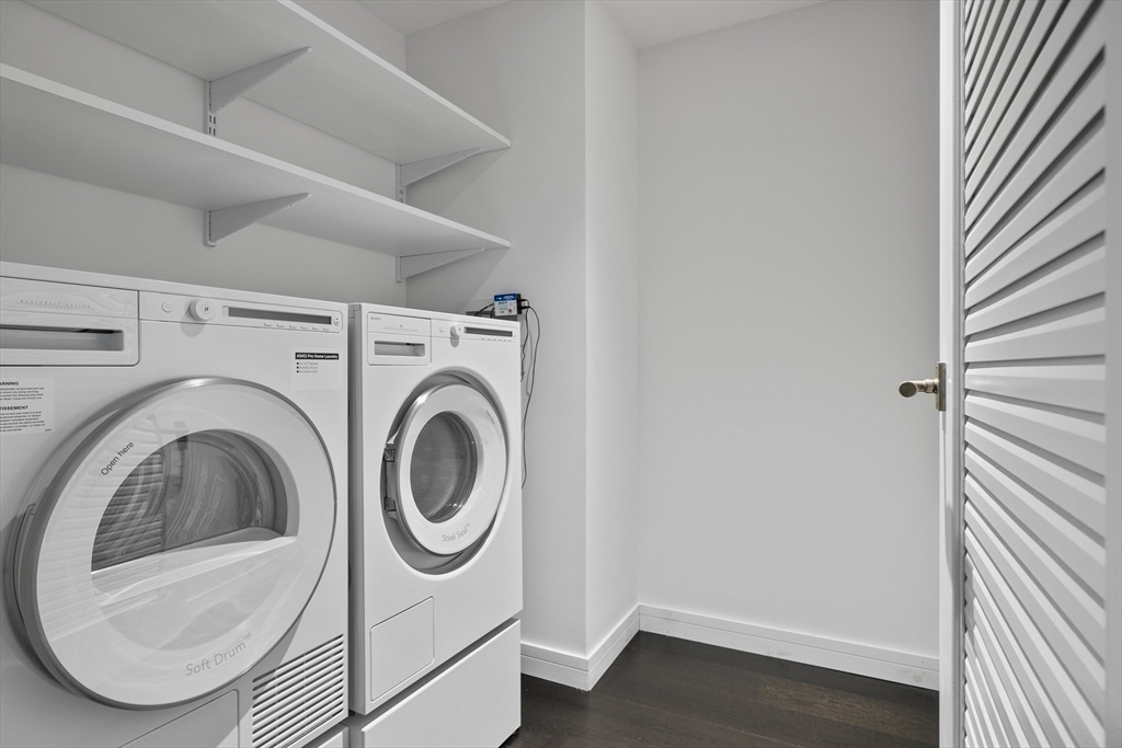 150 Seaport Boulevard, Unit 10D Boston, MA 02210 - Photo 11 of 23 a utility room with dryer and washer