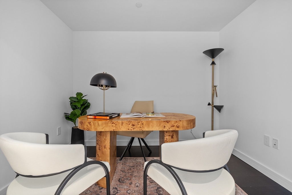 150 Seaport Boulevard, Unit 10D Boston, MA 02210 - Photo 10 of 23 a dining room with furniture and wooden floor