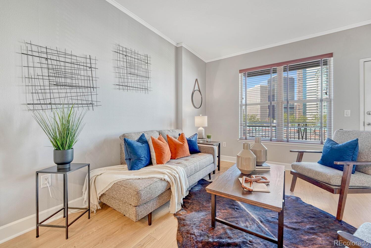 1975 Grant Street, Unit 509 Denver, CO 80203 - Photo 12 of 30 a living room with furniture and a potted plant