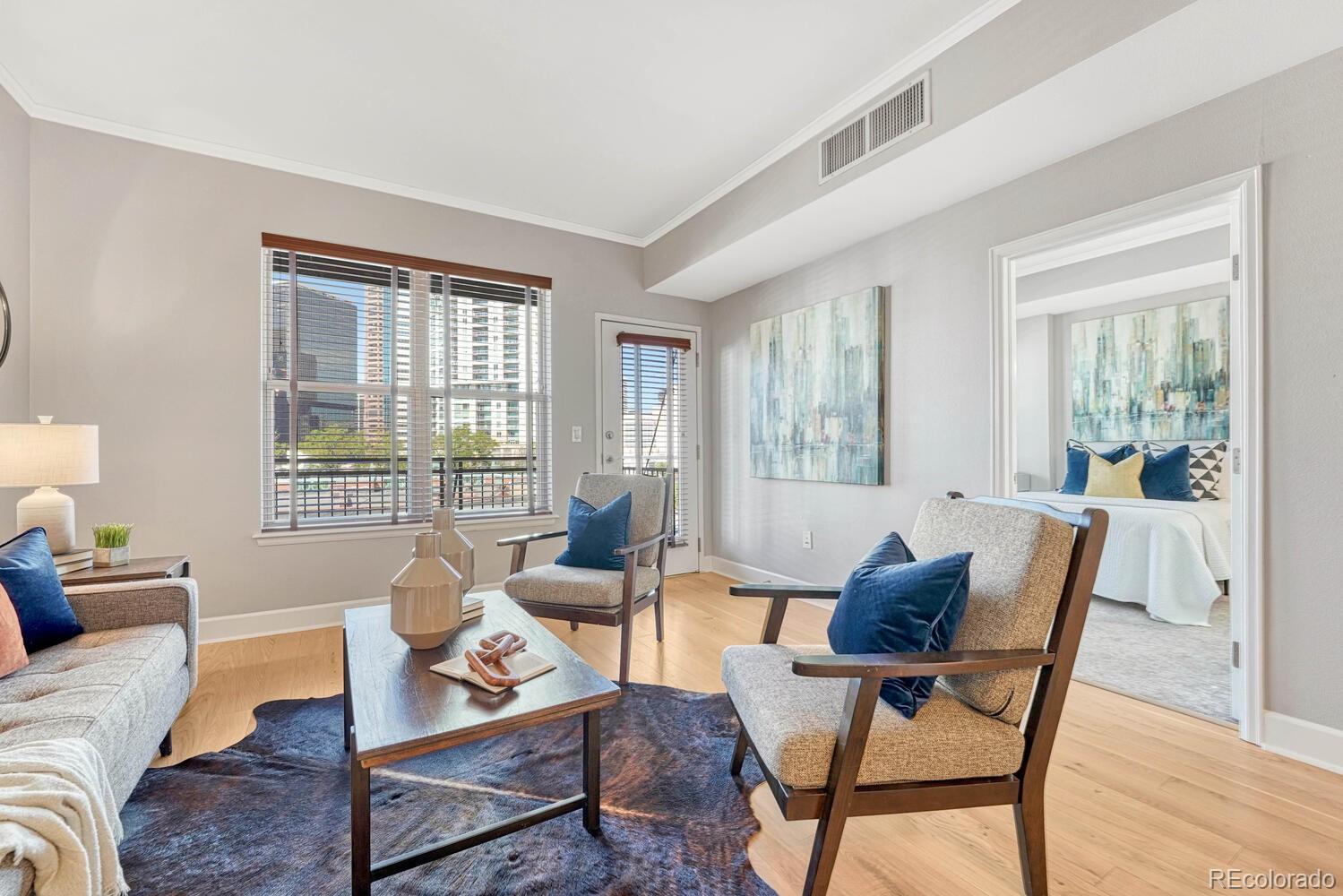 1975 Grant Street, Unit 509 Denver, CO 80203 - Photo 13 of 30 a living room with furniture and a window