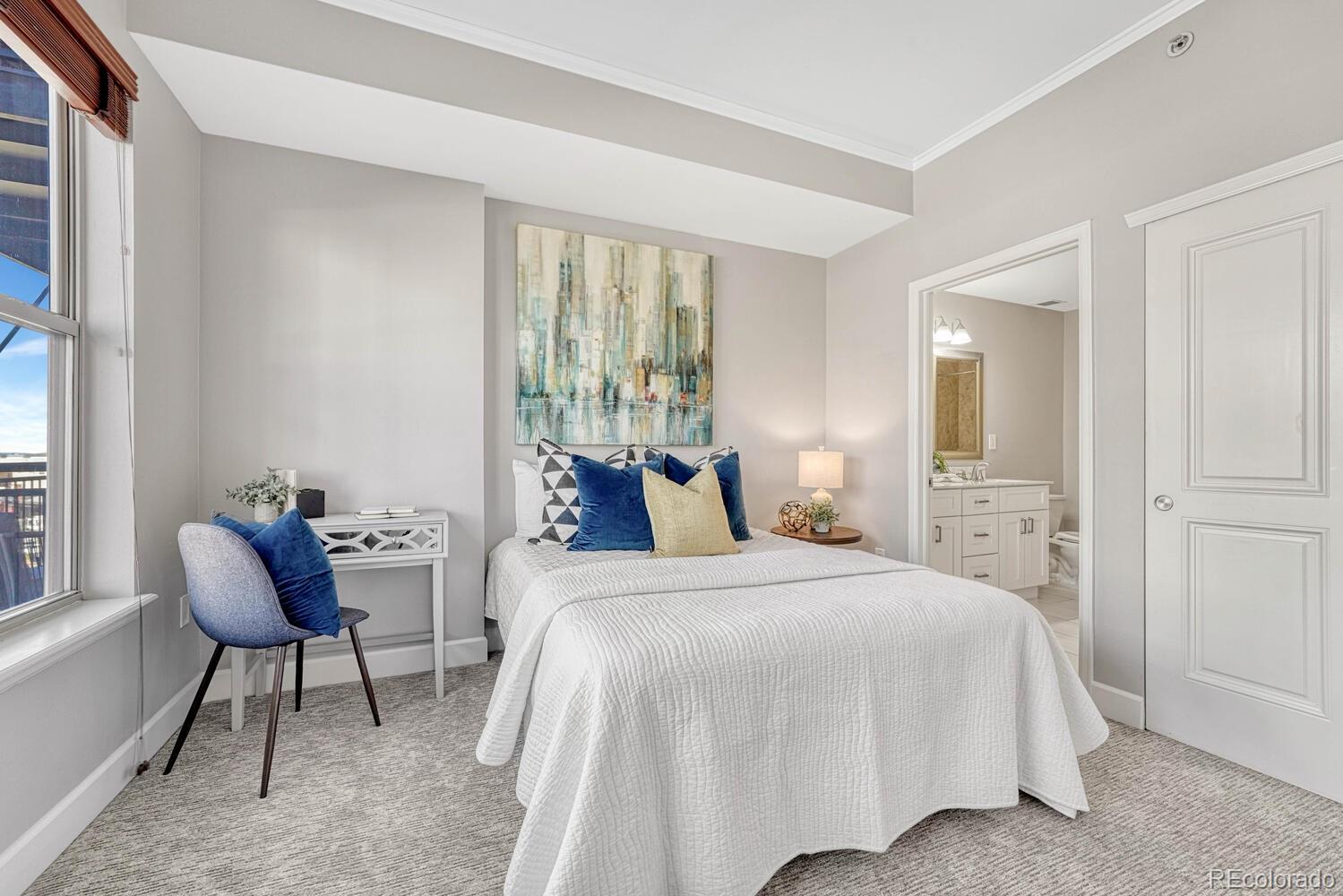 1975 Grant Street, Unit 509 Denver, CO 80203 - Photo 18 of 30 a bedroom with a bed and a window