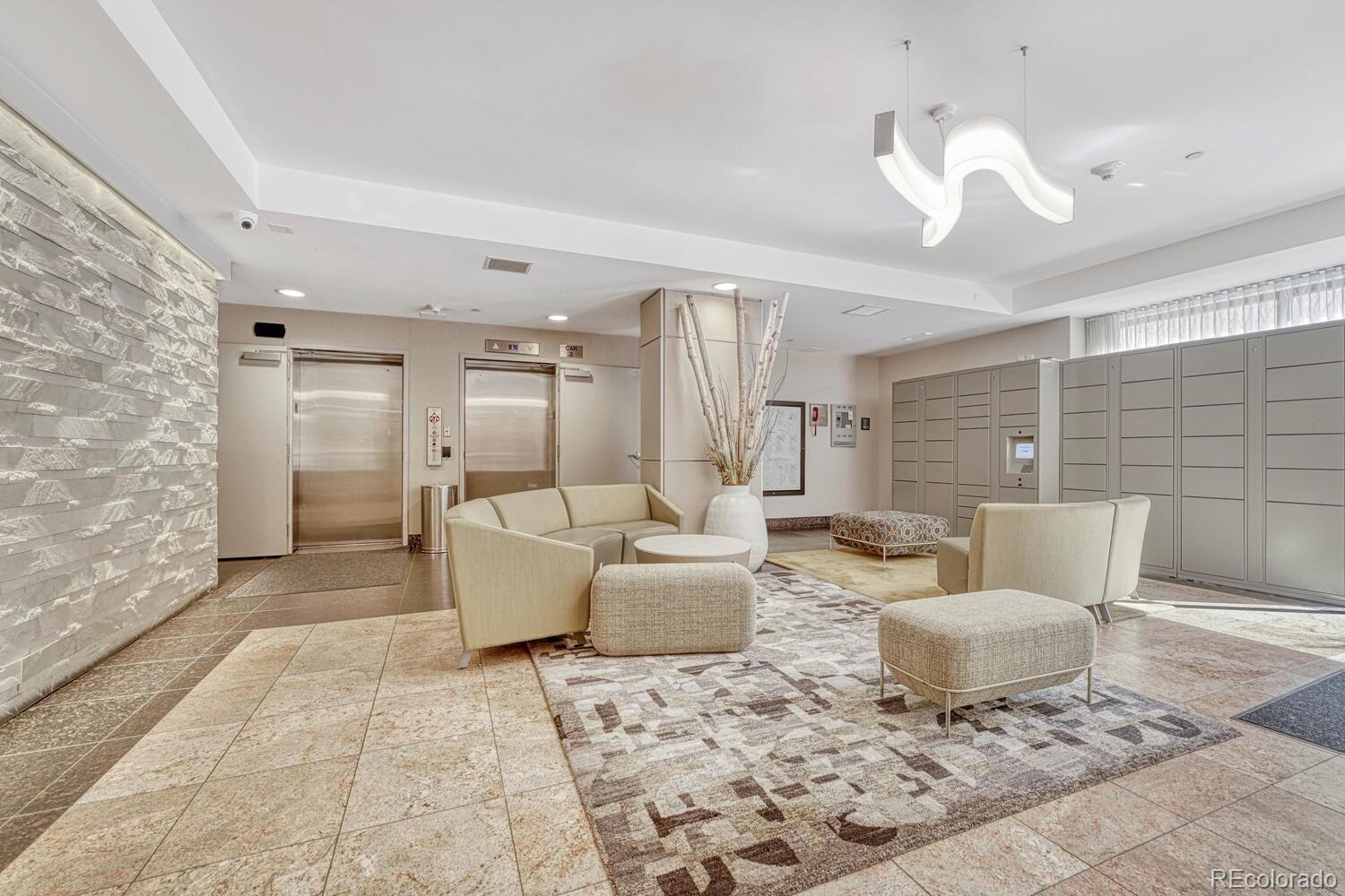 1975 Grant Street, Unit 509 Denver, CO 80203 - Photo 23 of 30 a living room with furniture and a fireplace