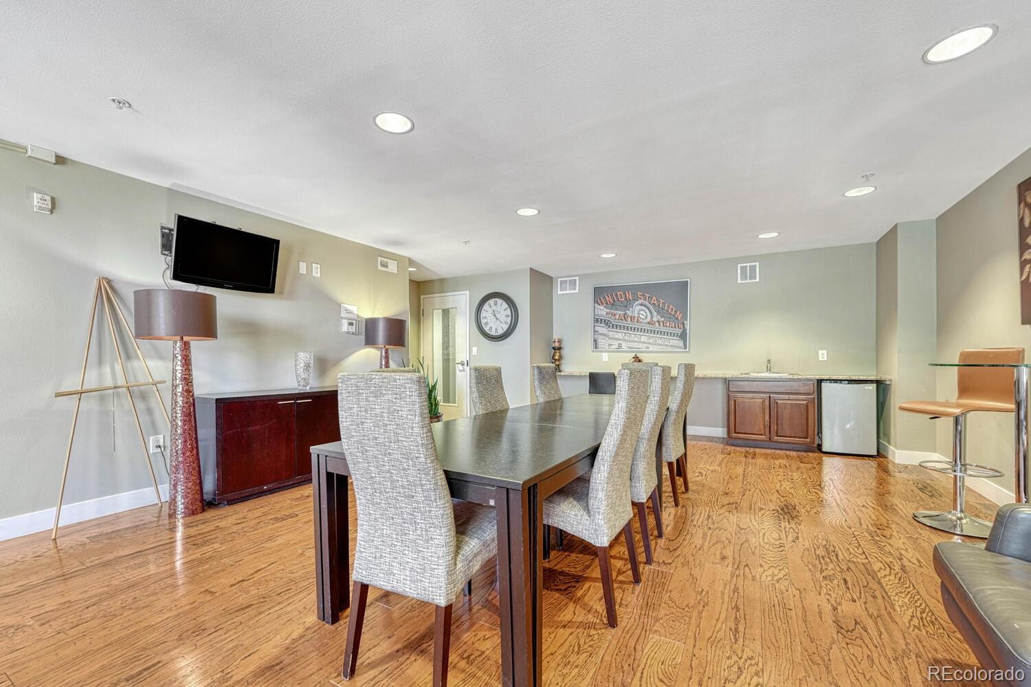 1975 Grant Street, Unit 509 Denver, CO 80203 - Photo 25 of 30 a view of a dining room with furniture and wooden floor