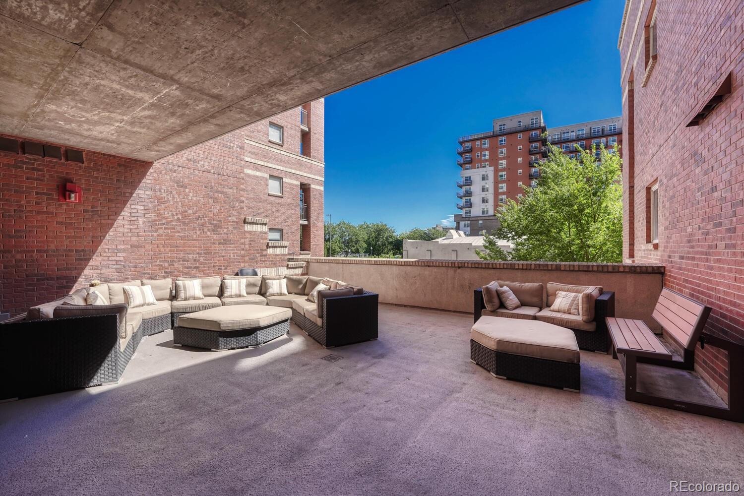 1975 Grant Street, Unit 509 Denver, CO 80203 - Photo 26 of 30 a outdoor living space with furniture and a potted plant