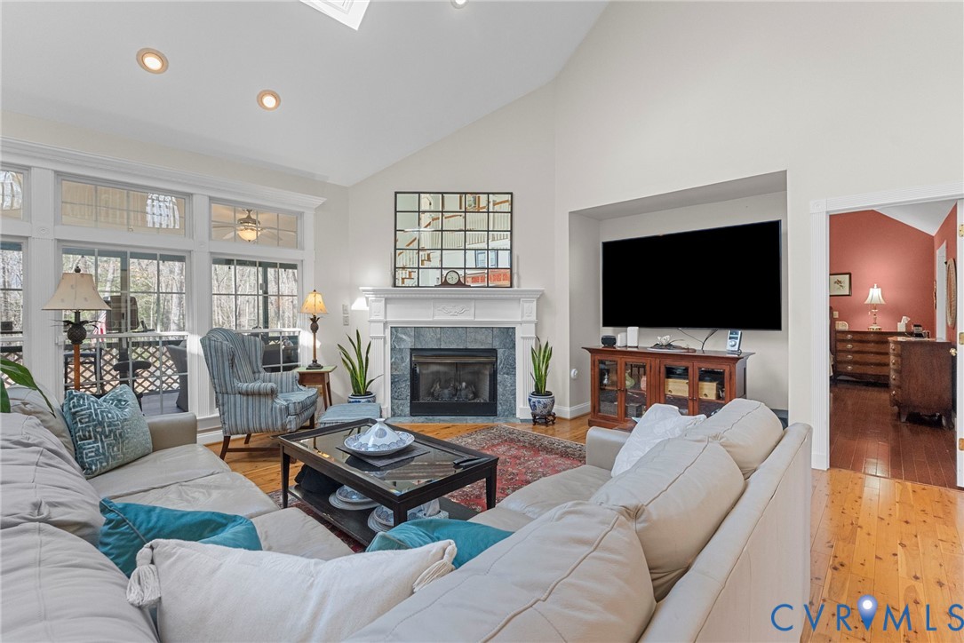 13300 Old Telegraph Road Providence Forge, VA 23140 - Photo 12 of 46 a living room with furniture a flat screen tv and a fireplace
