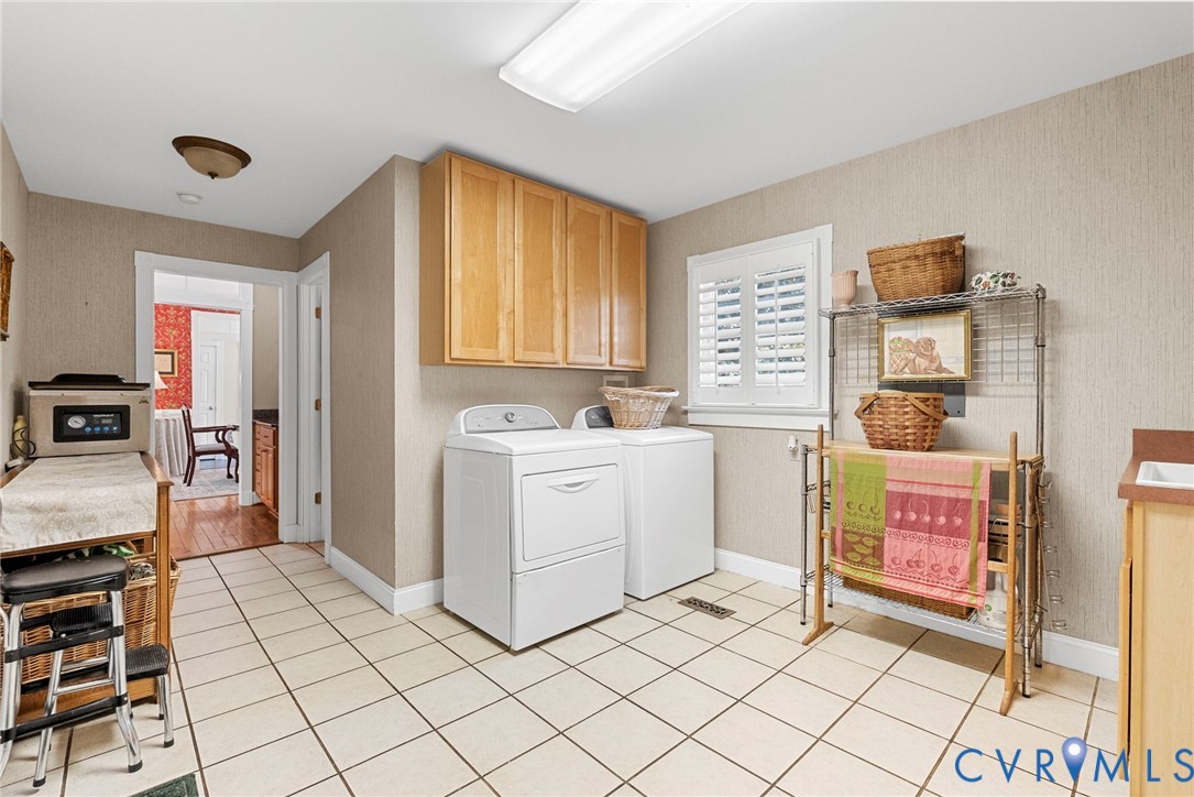 13300 Old Telegraph Road Providence Forge, VA 23140 - Photo 18 of 46 a utility room with cabinets washer and dryer
