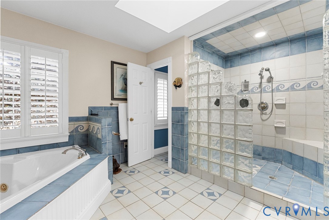 13300 Old Telegraph Road Providence Forge, VA 23140 - Photo 26 of 46 a bathroom with a bathtub and a shower