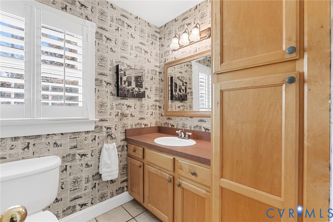 13300 Old Telegraph Road Providence Forge, VA 23140 - Photo 28 of 46 a bathroom with a granite countertop sink toilet and shower
