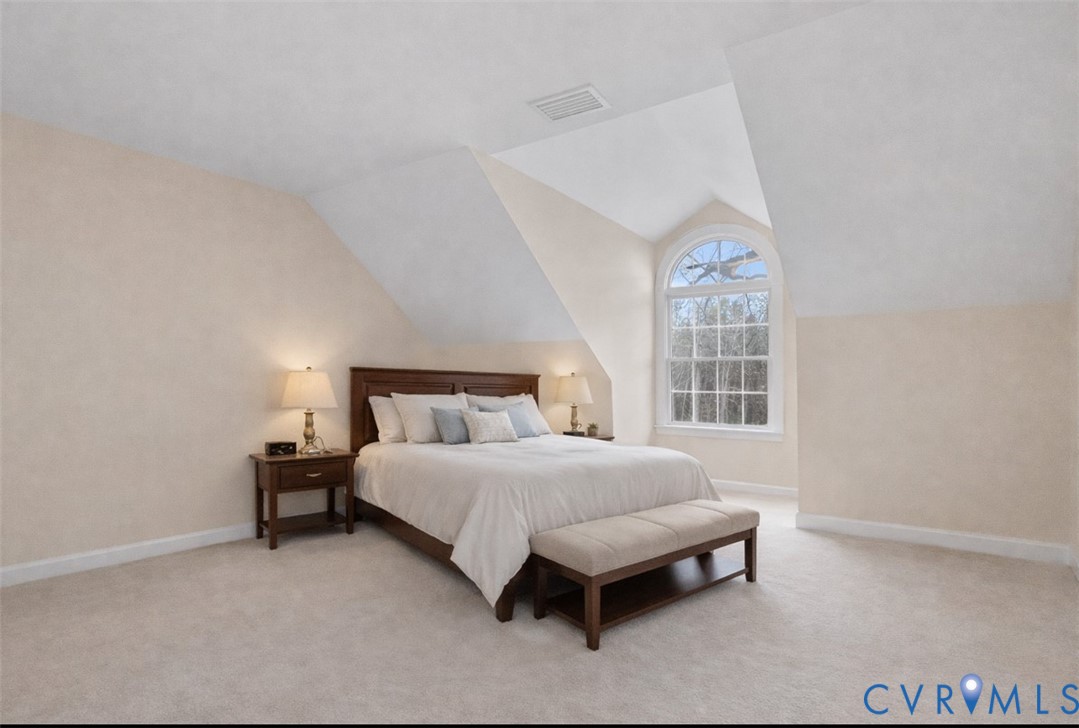 13300 Old Telegraph Road Providence Forge, VA 23140 - Photo 31 of 46 a bedroom with a bed lamp and a window