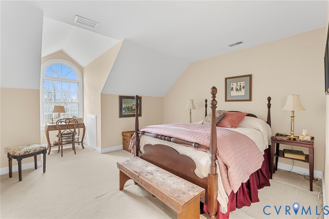 13300 Old Telegraph Road Providence Forge, VA 23140 - Photo 32 of 46 a bedroom with a bed and a table in it