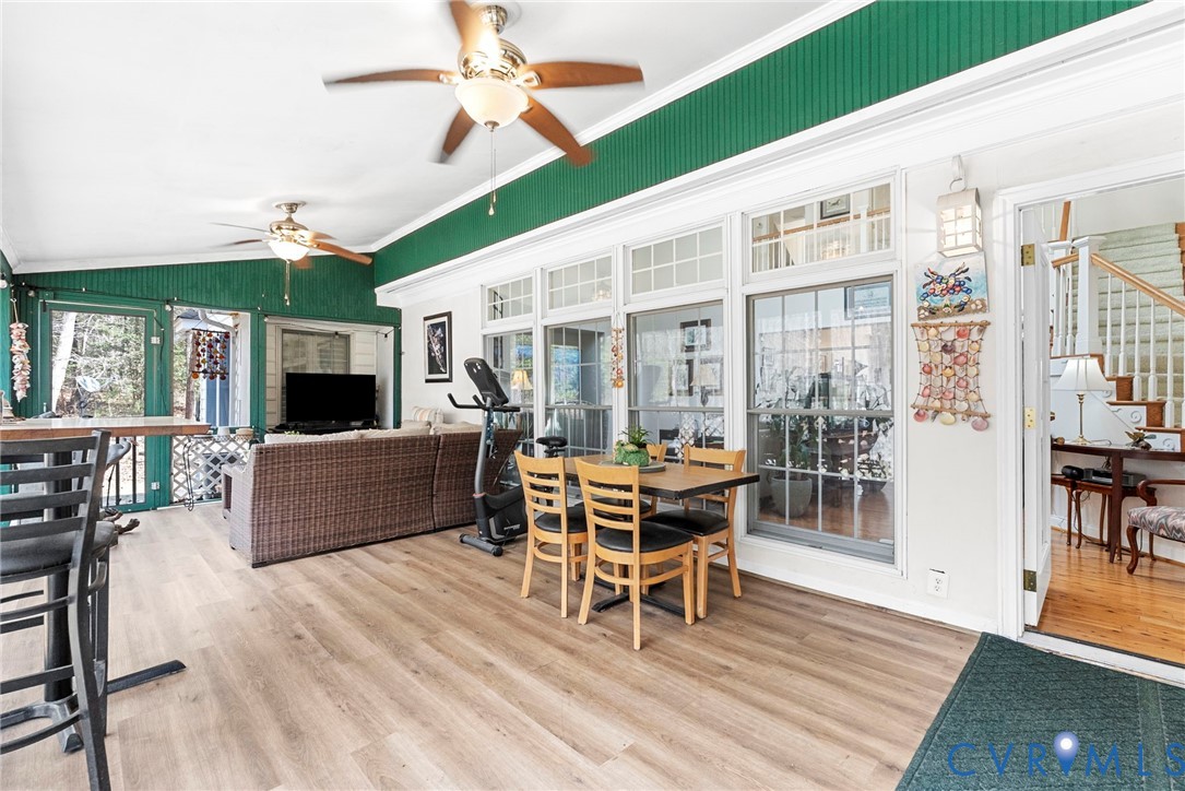 13300 Old Telegraph Road Providence Forge, VA 23140 - Photo 34 of 46 a living room with furniture wooden floor and a floor to ceiling window