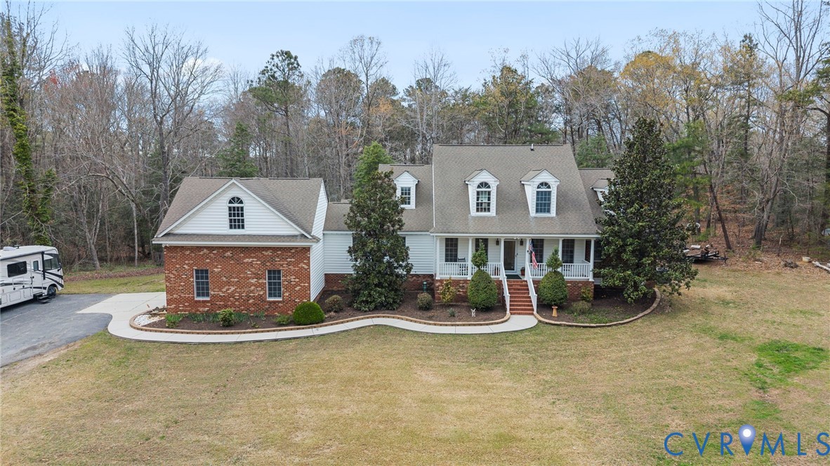 13300 Old Telegraph Road Providence Forge, VA 23140 - Photo 43 of 46 a front view of a house with garden