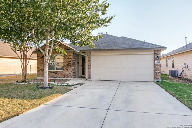 a front view of a house with a glass door
