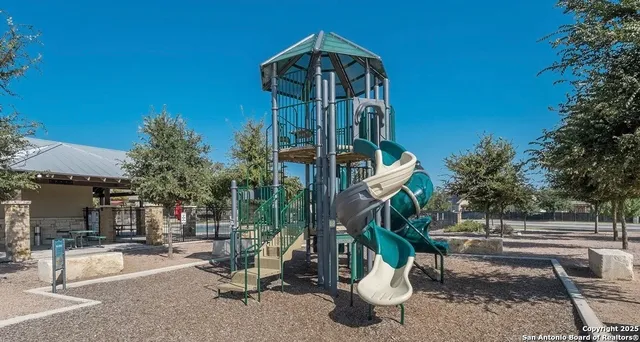 a view of a house with patio and a yard