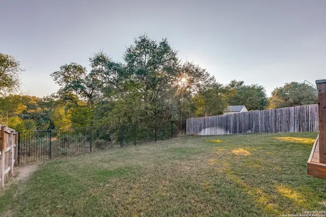 a view of a backyard with a small cabin