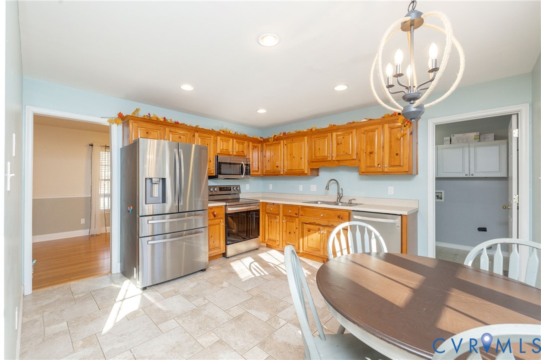 15619 Devlin Drive Chesterfield, VA 23838 - Photo 13 of 46 a view of a kitchen with a sink and refrigerator