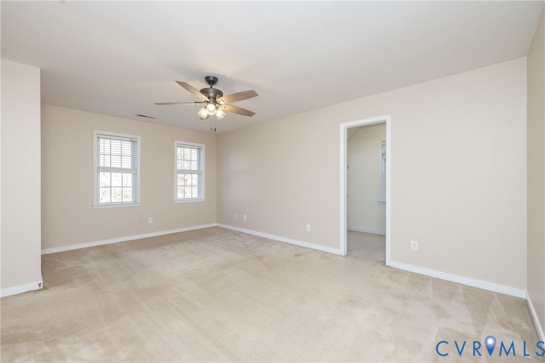 15619 Devlin Drive Chesterfield, VA 23838 - Photo 23 of 46 an empty room with windows and ceiling fan
