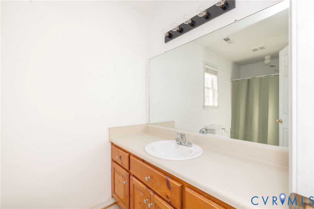 15619 Devlin Drive Chesterfield, VA 23838 - Photo 24 of 46 a bathroom with a sink and a mirror