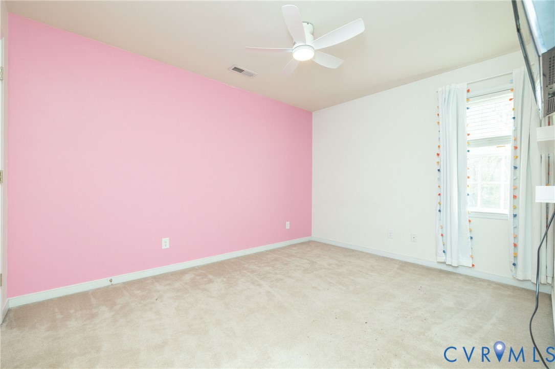 15619 Devlin Drive Chesterfield, VA 23838 - Photo 30 of 46 an empty room with a ceiling fan and window