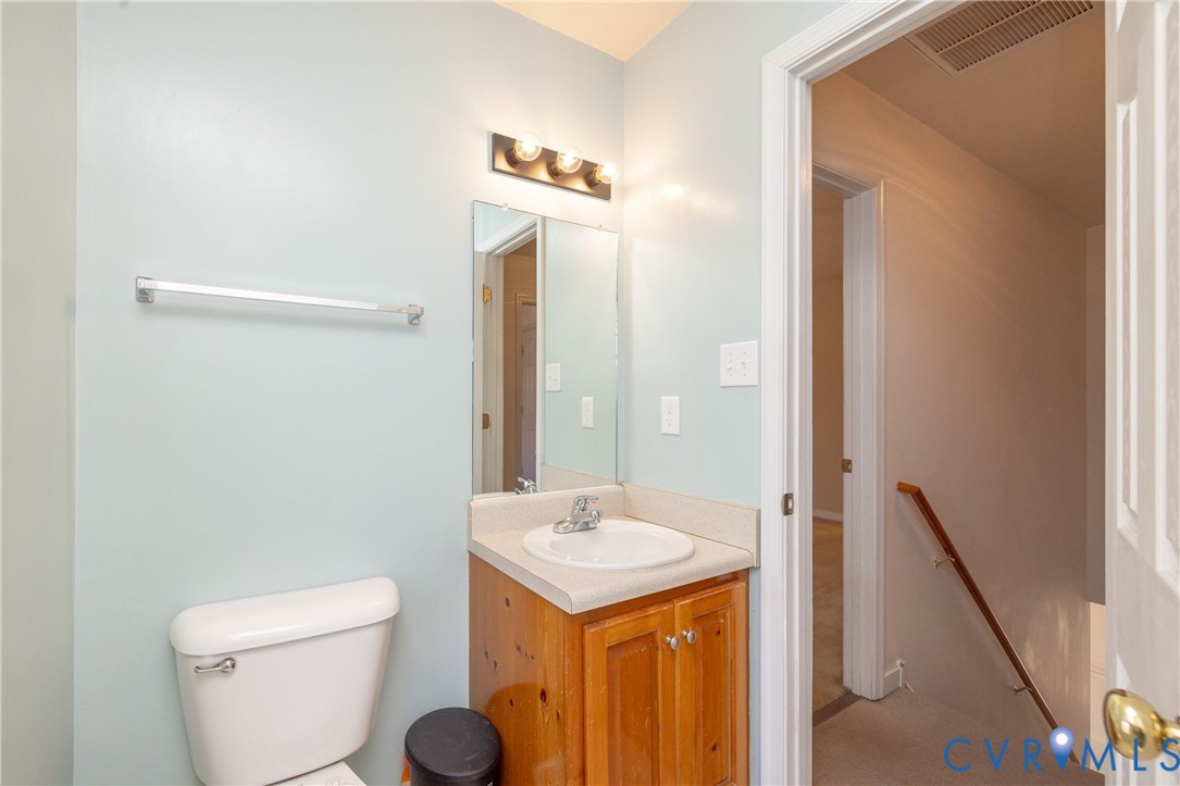 15619 Devlin Drive Chesterfield, VA 23838 - Photo 32 of 46 a bathroom with a toilet a sink and a mirror