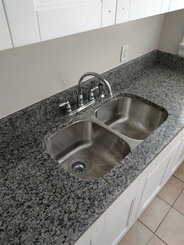 906 Canterbury Road Raleigh, NC 27607 - Photo 8 of 8 a close view of sink and tap