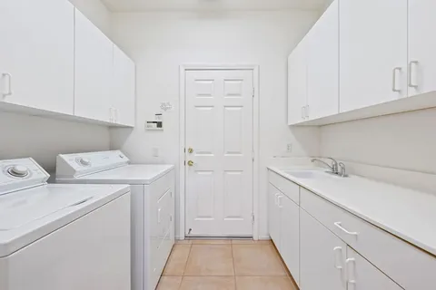 a view of swimming pool with outdoor seating and plants