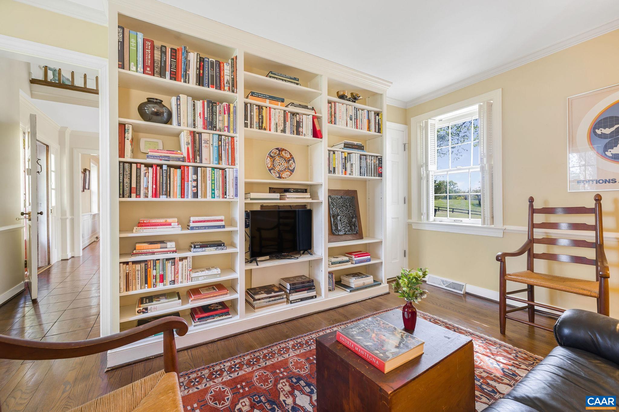 2176 Lindsay Road Gordonsville, VA 22942 - Photo 15 of 70 a living room with furniture a bookshelf and a window