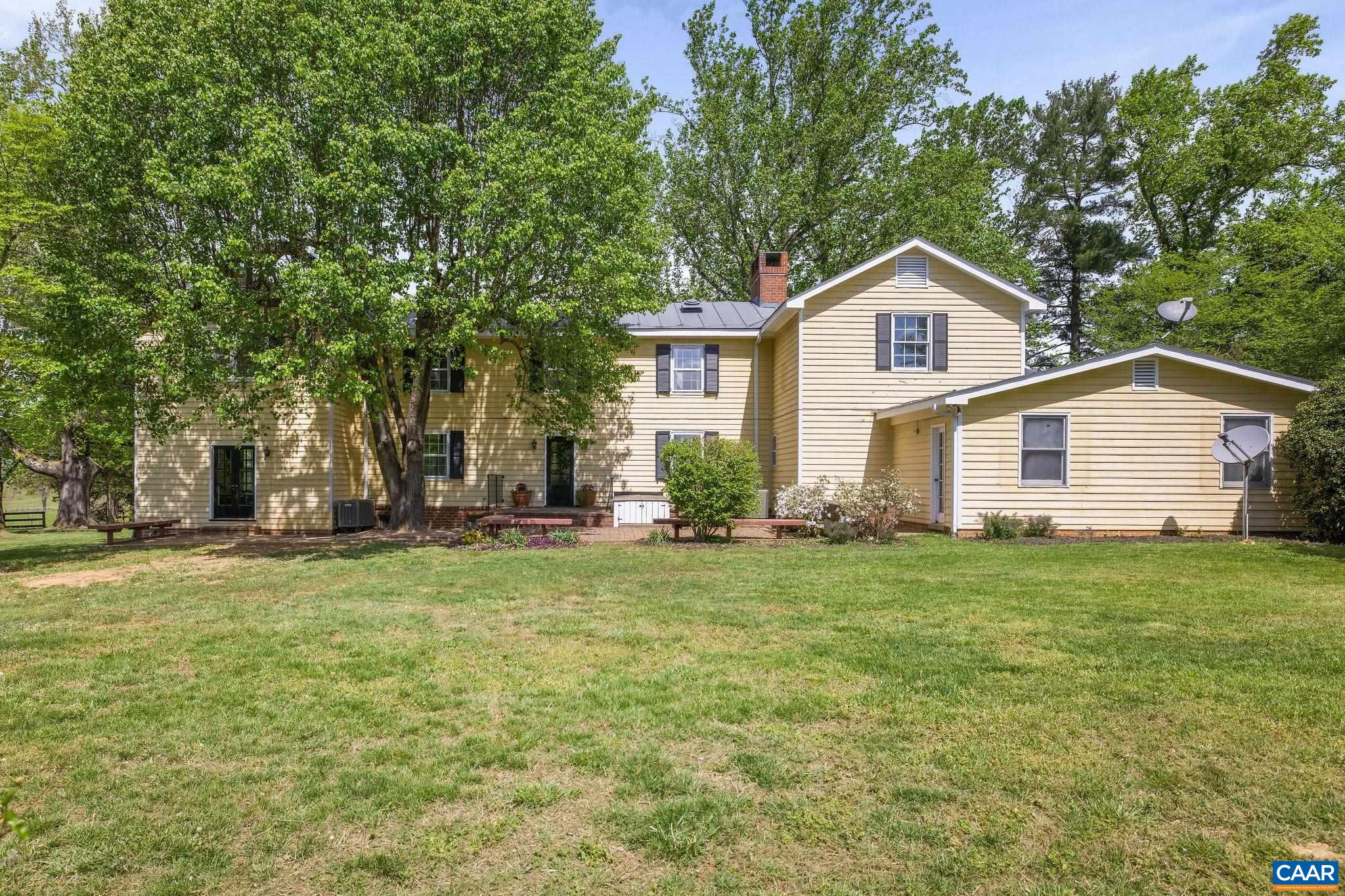 2176 Lindsay Road Gordonsville, VA 22942 - Photo 38 of 70 a view of a yard in front of a house with plants and large tree