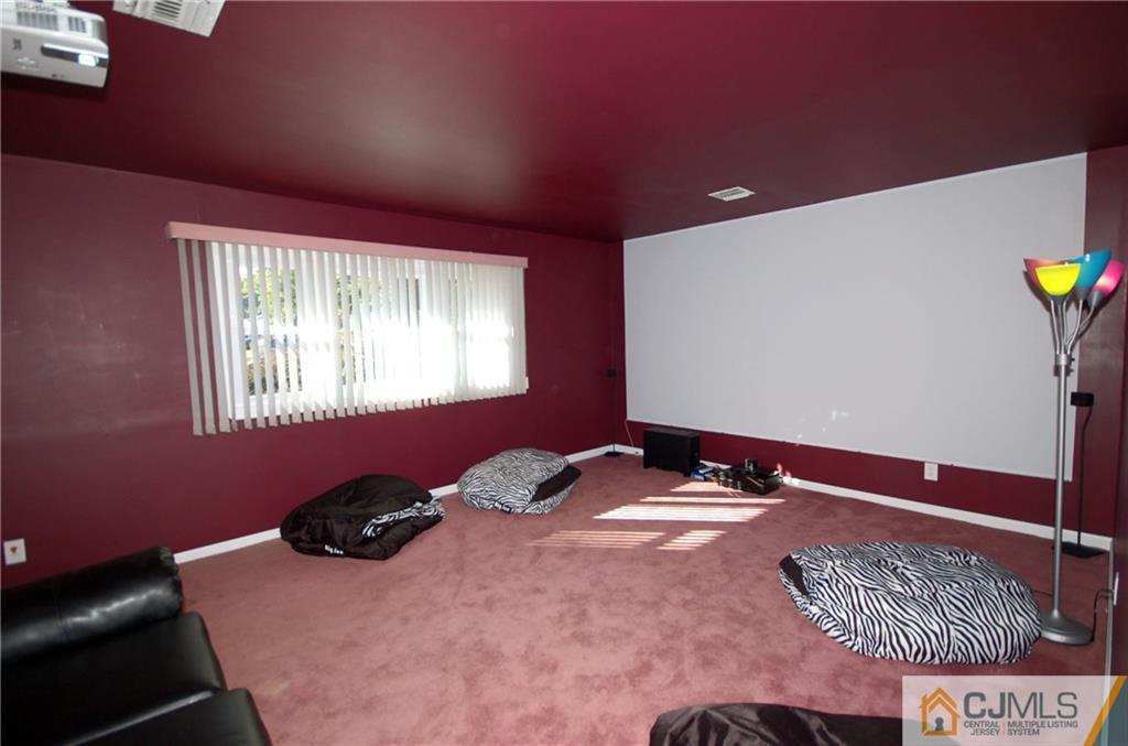 33 Stony Road Edison, NJ 08817 - Photo 17 of 25 a bedroom with a bed and a window