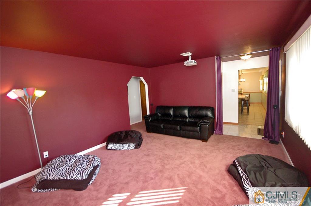 33 Stony Road Edison, NJ 08817 - Photo 18 of 25 a bedroom with a bed dresser and a large window