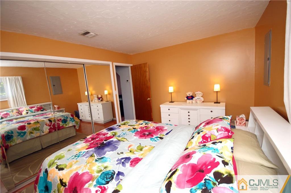 33 Stony Road Edison, NJ 08817 - Photo 20 of 25 a bedroom with bed and wooden floor