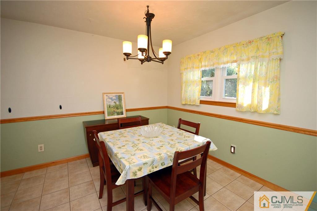 33 Stony Road Edison, NJ 08817 - Photo 7 of 25 a view of a dining room with a table and chairs
