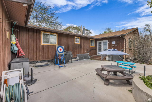 10705 Green Ridge Drive Sandy, UT 84070 - Photo 45 of 55 View of patio / terrace featuring french doors