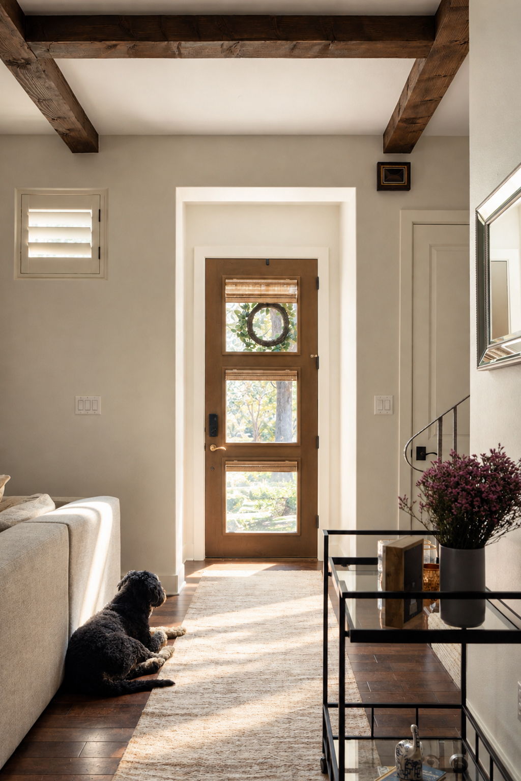 2324 Kinney Road Austin, TX 78704 - Photo 2 of 35 Richly textured wood beams and classic hardwood flooring frame a welcoming, sunlit entry corridor.