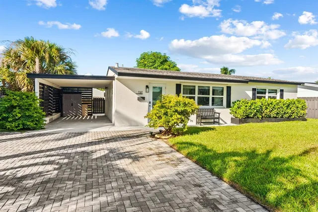 a front view of house with yard and green space