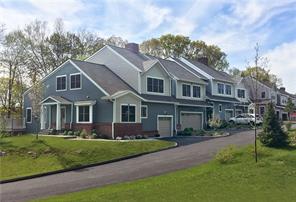 302 Boulder Ridge Road, Unit 24 South Salem, NY 10590 - Photo 1 of 1 a front view of a house with a garden